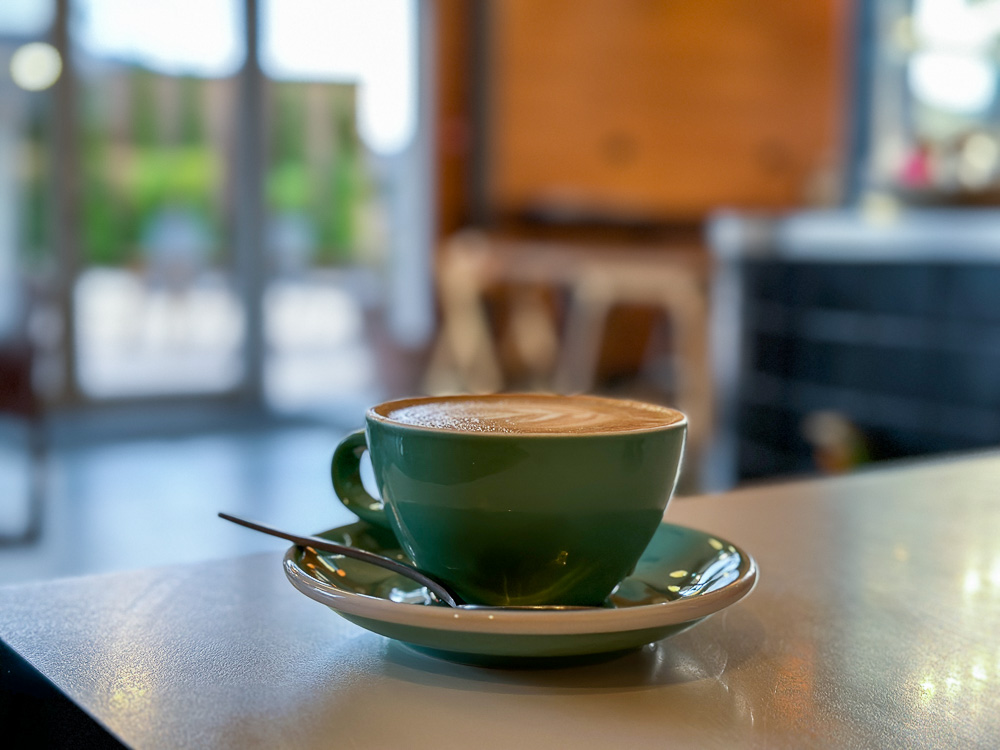 Coffee cup sitting on a table at a cafe