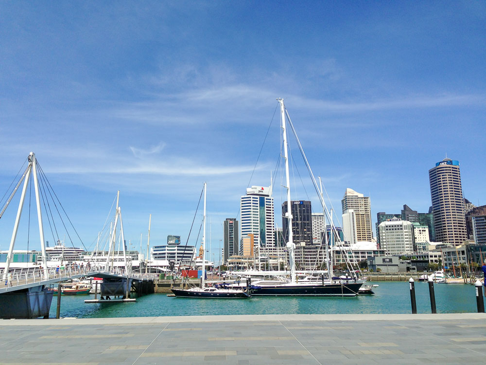 Sailboats in the Viaduct Harbour with Auckland City skyline in the background.