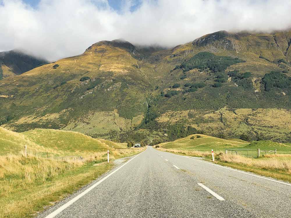 rural road with mountain in the background