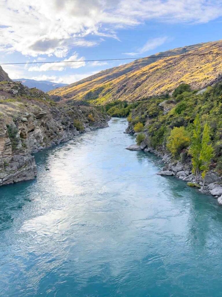 blue river running through rocky gorge