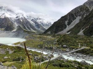 Mueller Lake Lookout featuring the first swing bridge and views of snow capped mountains on the Hooker Valley Track.