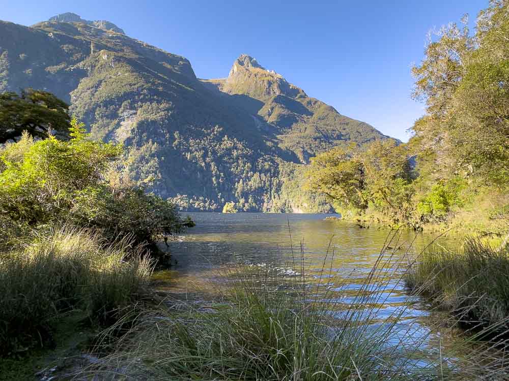 lake with green mountain in background