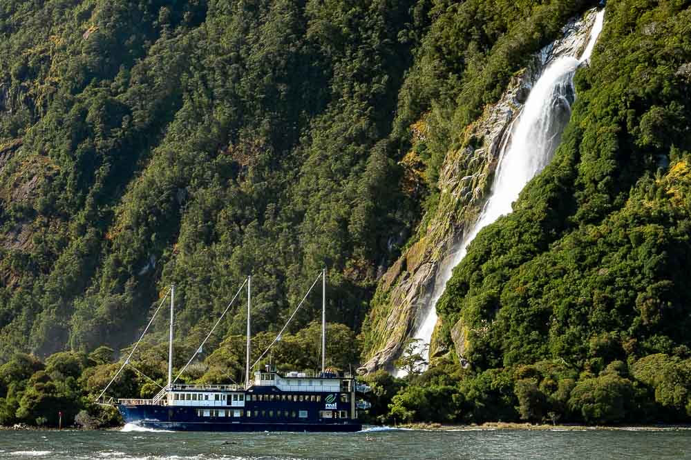 Milford Sound overnight cruise going past bowen falls in Milford Sound.