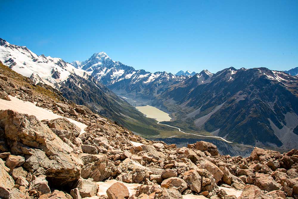 Elevated view of the Hooker Valley, proglacial lakes and Aoraki/Mt Cook mountain peak from the Mueller Hut Route in Mt Cook National Park.