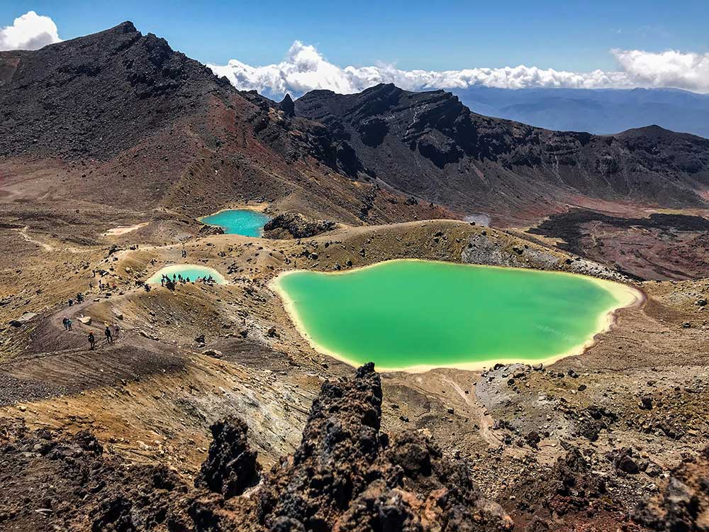 Emerald green lakes in the otherwise barren volcanic landscape of the Tongariro Crossing in New Zealand.