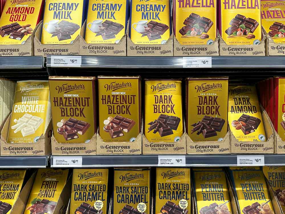 rows of whittakers chocolate on a shelf